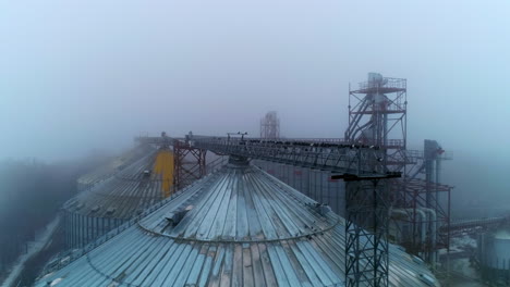 grain silos in fog