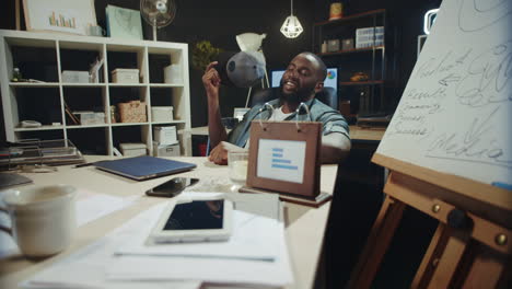 Black-manager-sitting-on-his-office