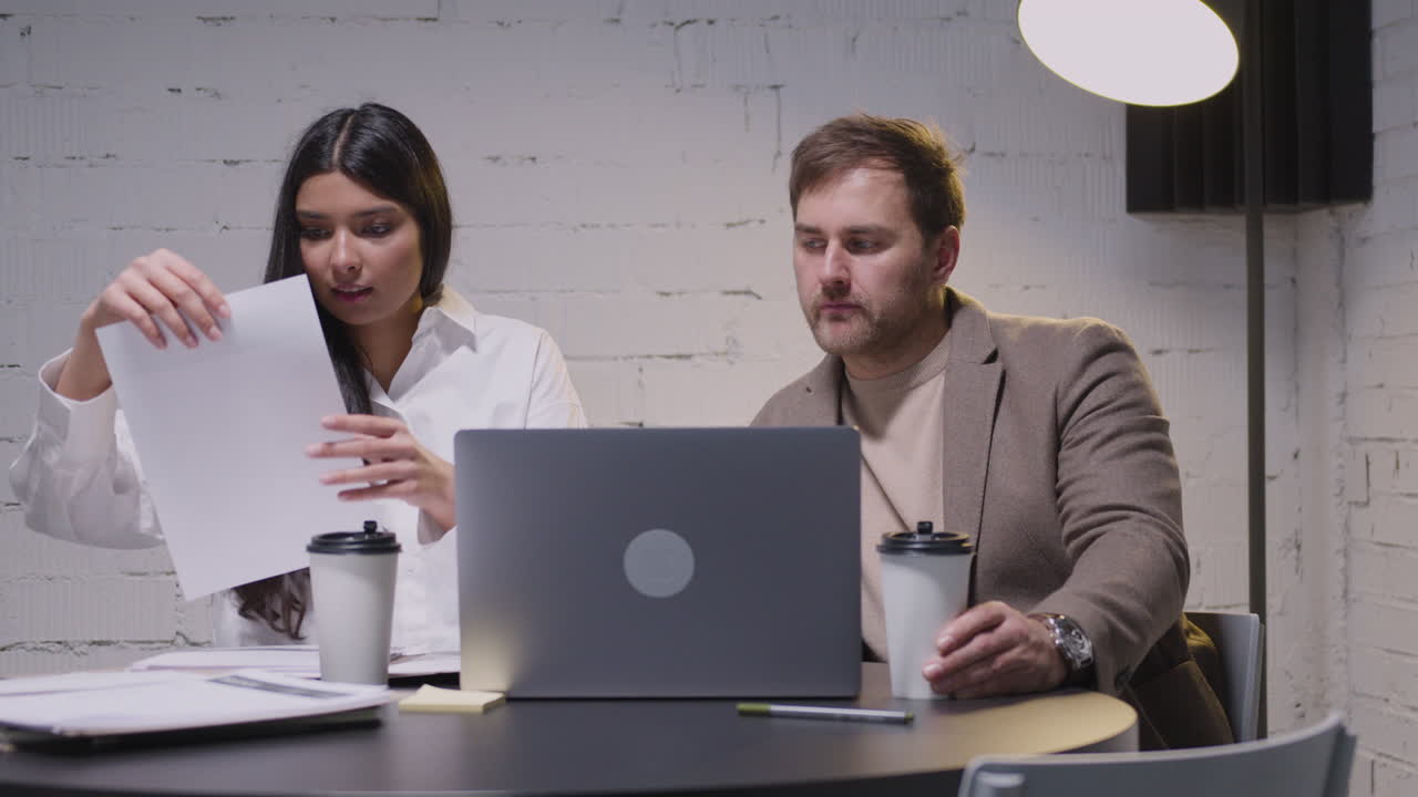 Man And Woman Having A Business Meeting Sitting At Desk In Boardroom 1