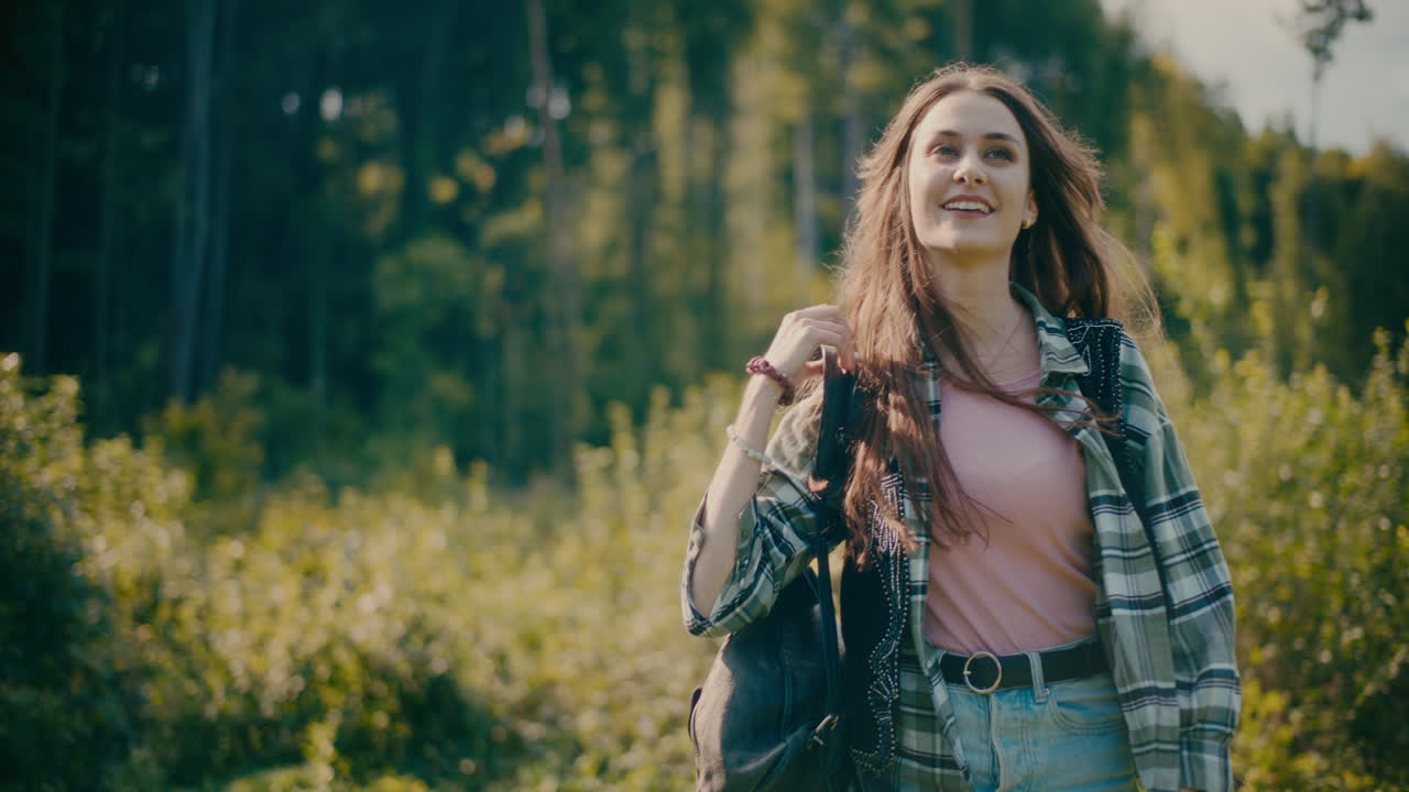 Smiling Woman Enjoying Walking In Forest