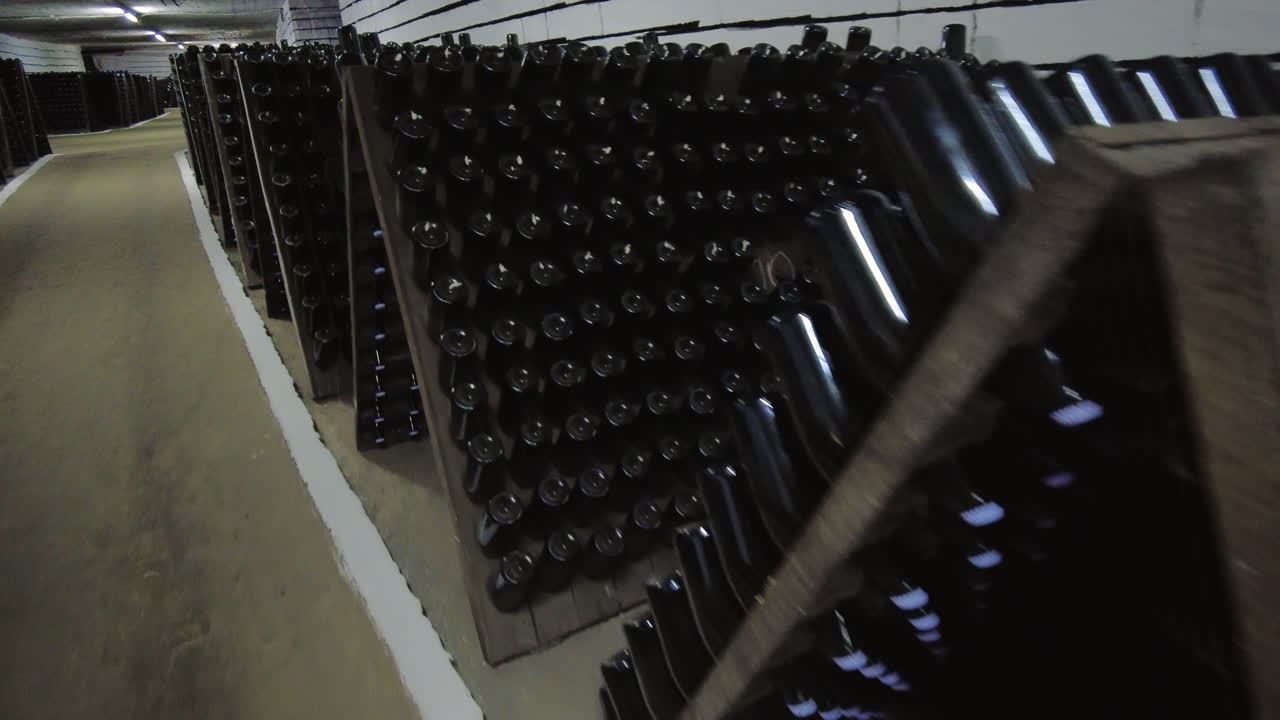 Wine bottles in a winery cellar