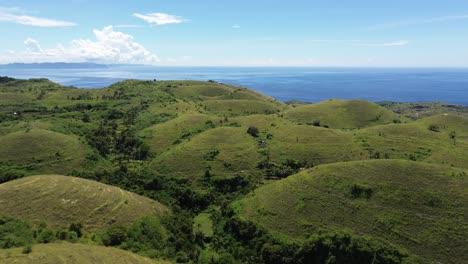 teletubbies hill with green rolling hills under a clear sky, indonesia