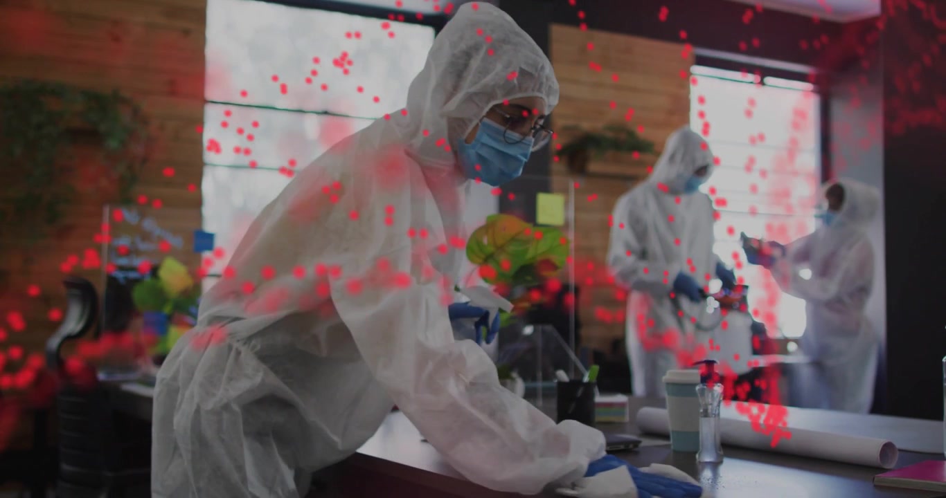 Red overlay appearing, female worker spraying and cleaning desk, moving lines showing spread