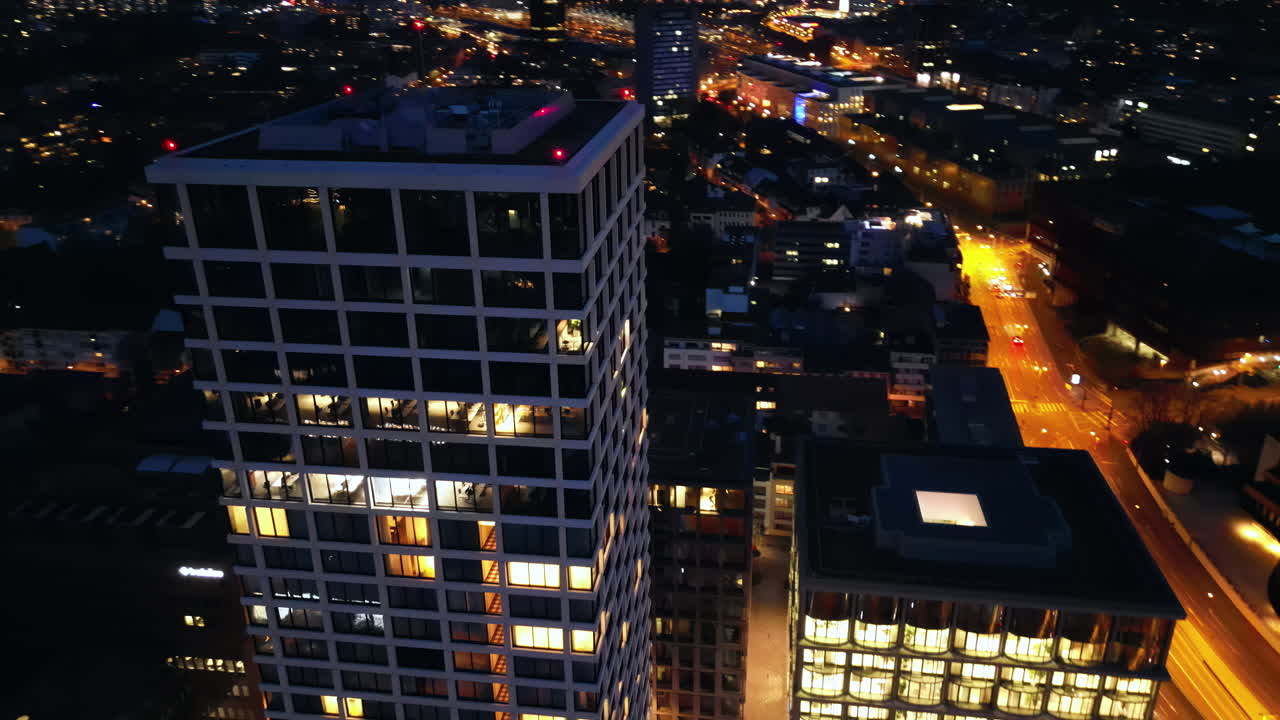 Aerial, drone view of Basel, Switzerland at night