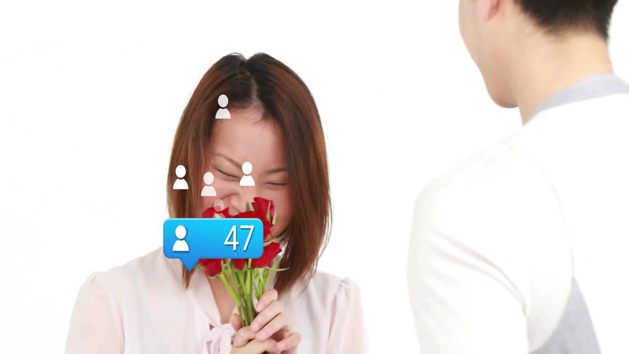 male presenting bouquet to female receiving gift for marketing, showing floating notification icons
