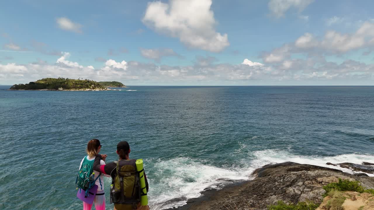 Couple Hiking with a Scenic Ocean View
