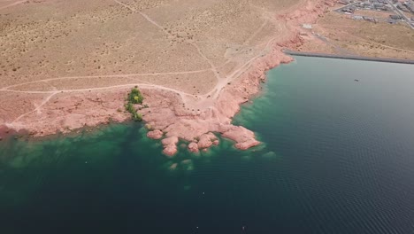 sand hollow state park, utah usa. tilt up aerial of water reservoir, red rock coastline and recreational area