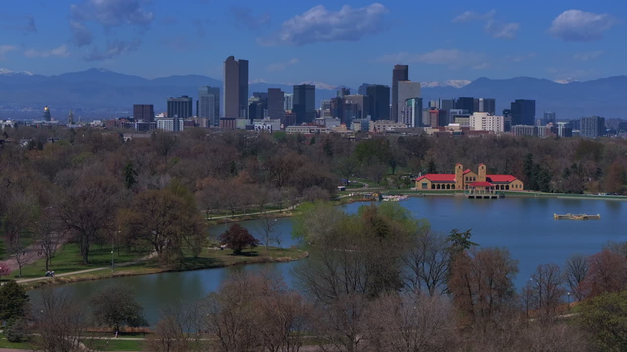 Downtown Denver City Park Colorado aerial drone Pavillon springtime summer tree wildflower blossom sunny morning blue sky Ferril Duck Lake bike walking path tall buildings skyscrapers static shot