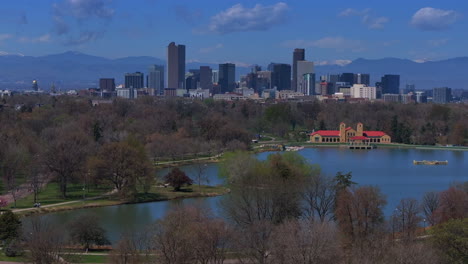 downtown denver city park colorado aerial drone pavillon springtime summer tree wildflower blossom sunny morning blue sky ferril duck lake bike walking path tall buildings skyscrapers static shot