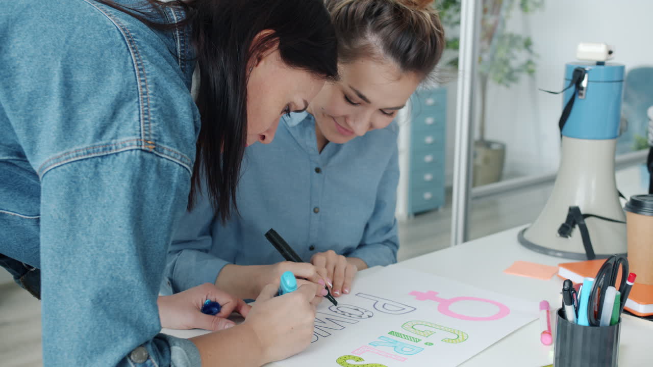 Women Collaborating on a Feminist Poster