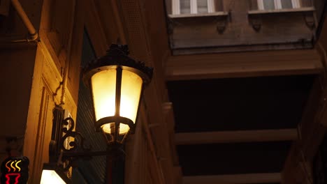 a single lamp post in an alleyway