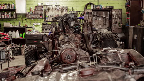 timelapse of mechanics stripping car down and lifting engine out using hoist in garage