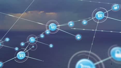animation of icons connected with lines over aerial view of ocean against cloudy sky
