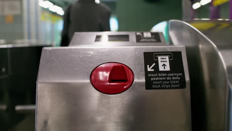 person using a subway ticket gate