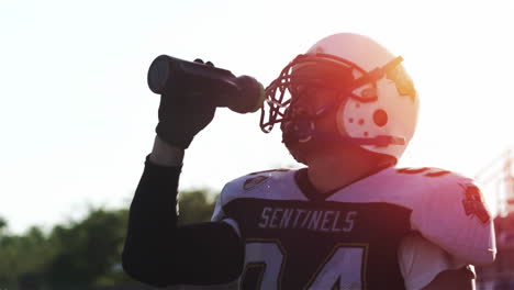 football player hydrating