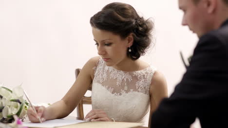 bride signing marriage license