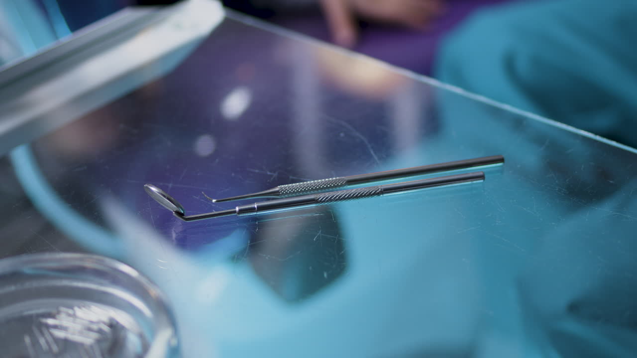 Dental tools on a glass table in a dentist office