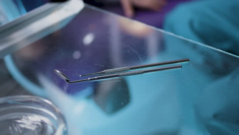 dental tools on a glass table in a dentist office