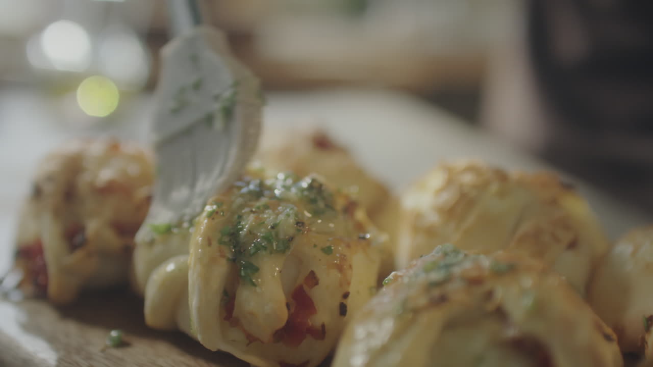 Adding Garlic Butter to Freshly Baked Buns
