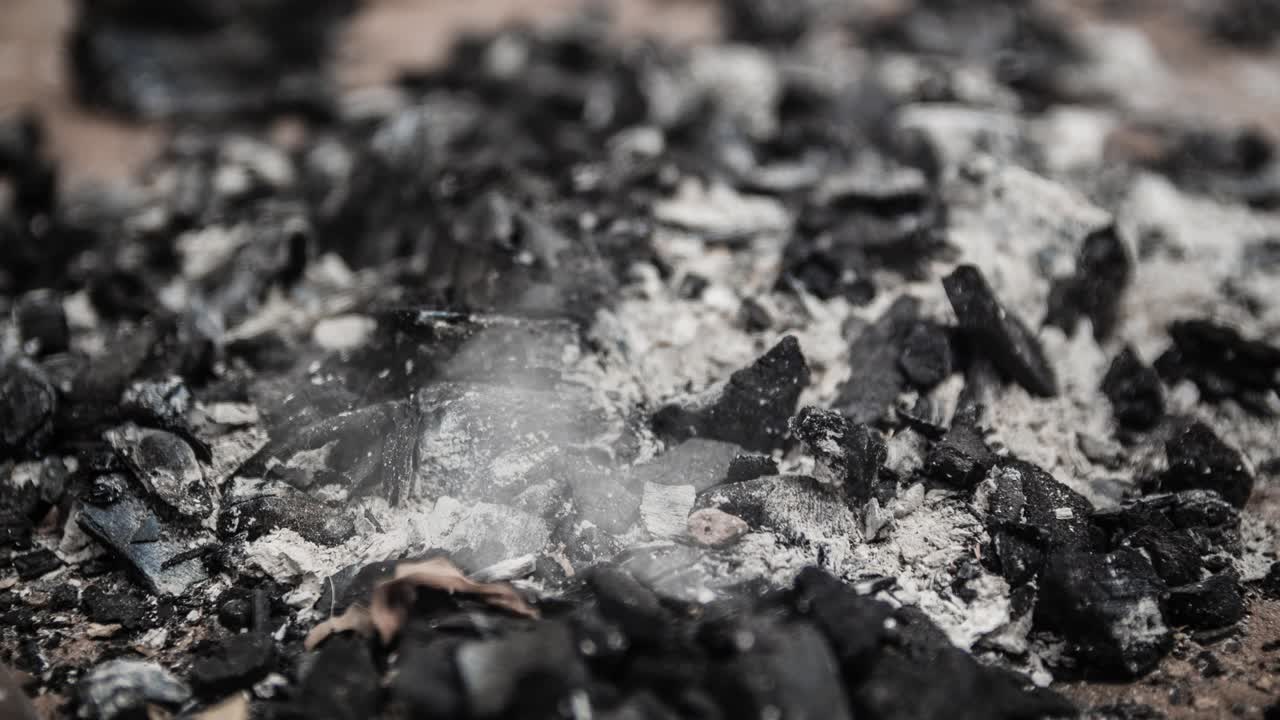 Cinemagraph of smoke emitted from burnt charcoal and ash