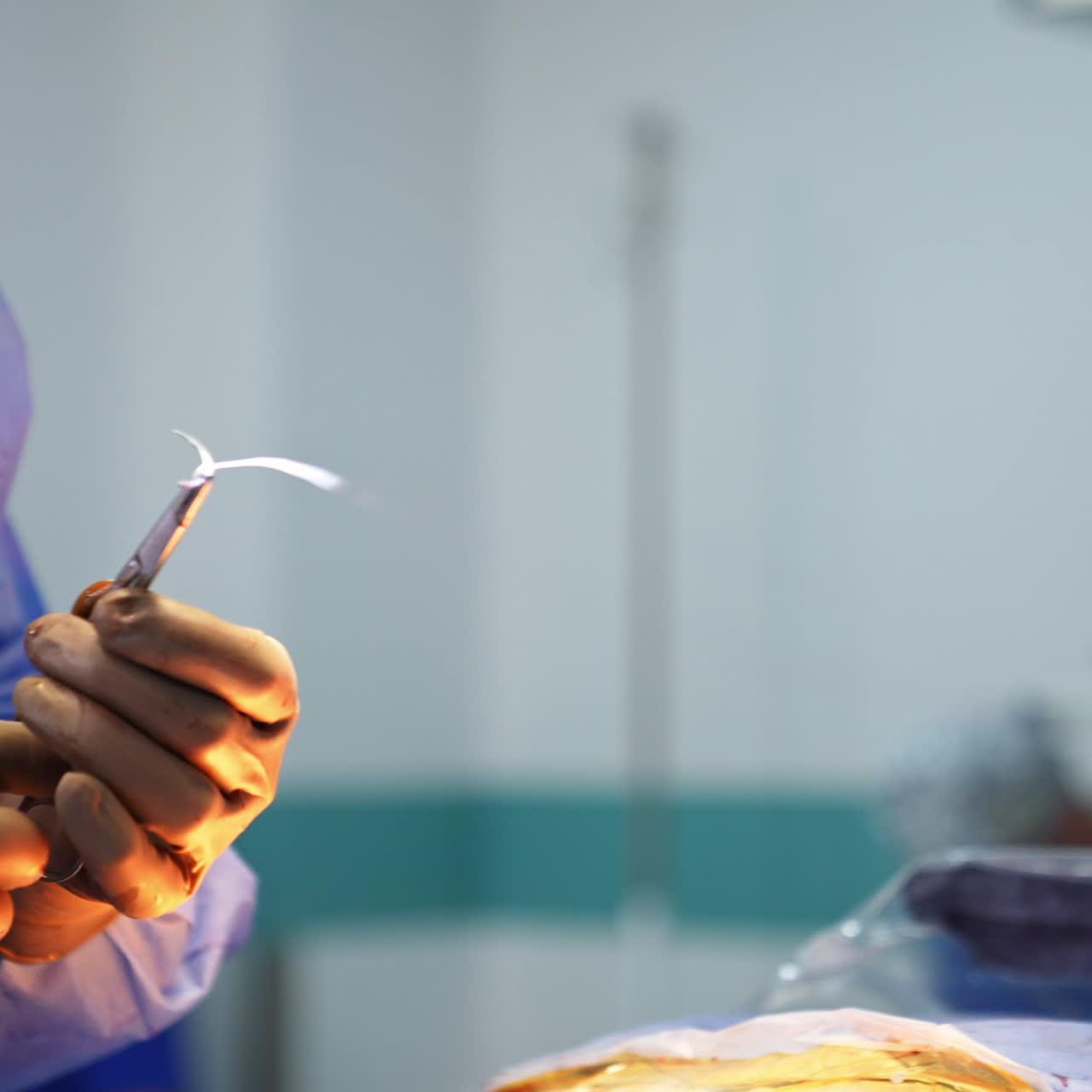 Medical devices for neurosurgery close up view. Hands in gloves making operation