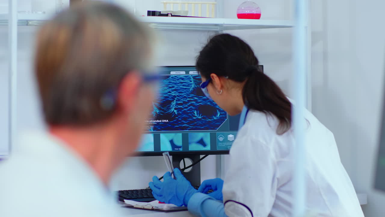Scientist nurse typing on computer in scientific laboratory