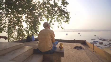 man overlooking river ganges