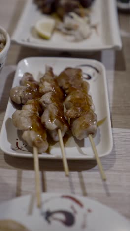close-up of grilled meat skewers on a plate