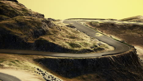 empty winding road through the valleys and hills