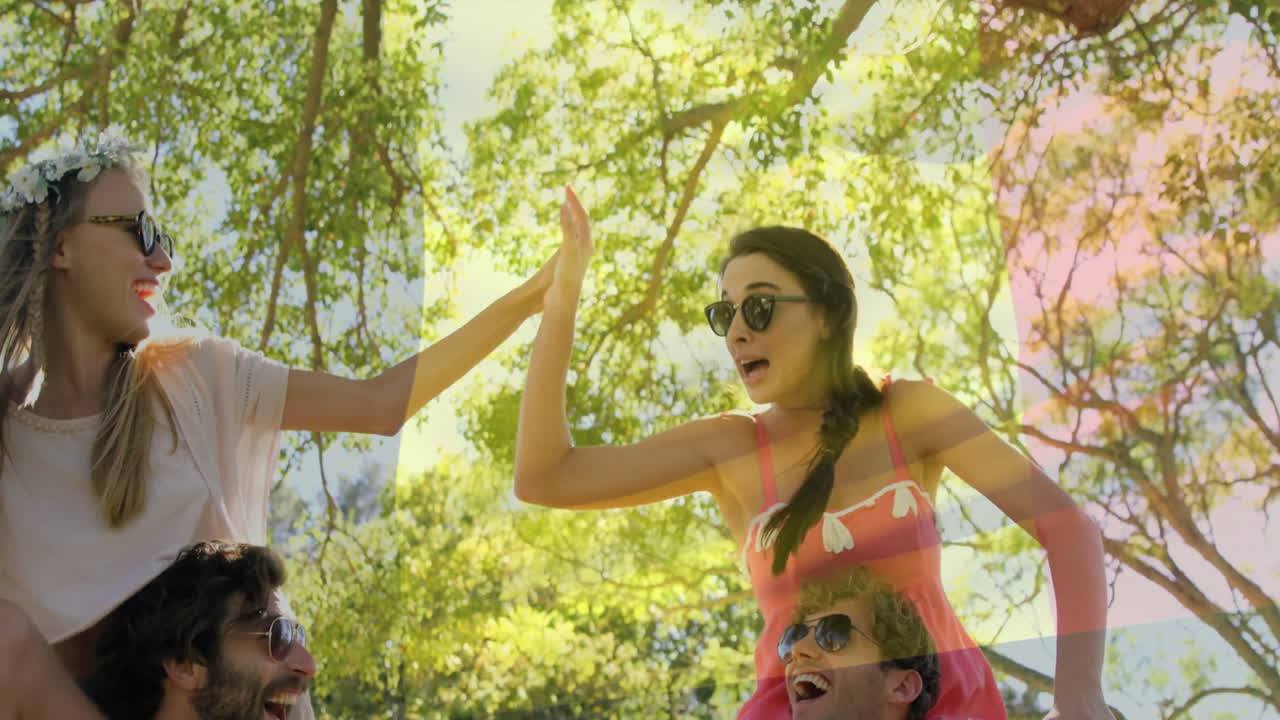 Wearing sunglasses and summer attire, young people gathering under trees outdoors