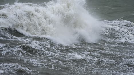 powerful waves crashing on the shore