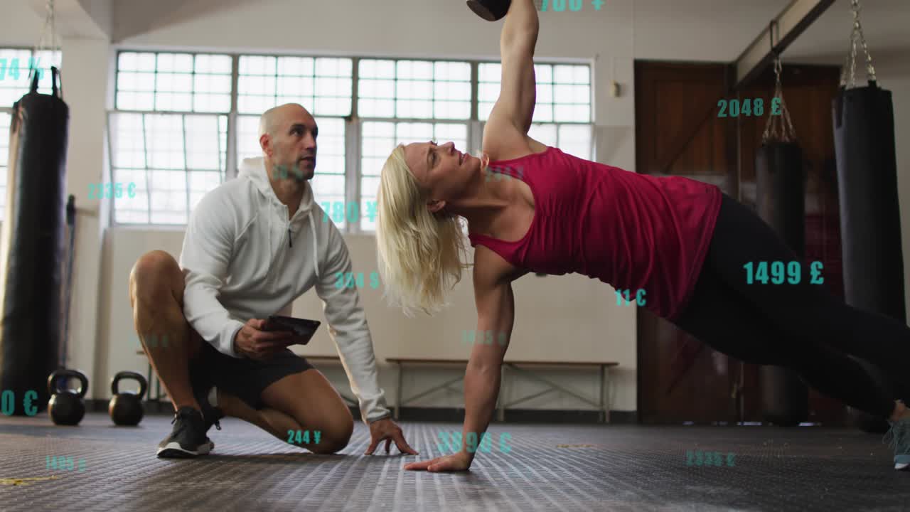 Trainer cueing, woman doing kettlebell sideplank to overhead press for core, metrics overlaying