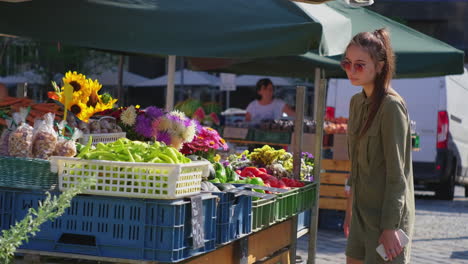 young woman browsing a farmers market