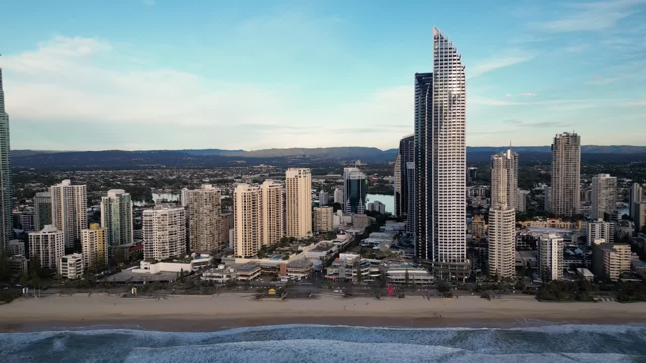 Morning aerial of Surfers Paradise skyline moving parallel to the beach, Gold Coast, Queensland, Australia 20230502