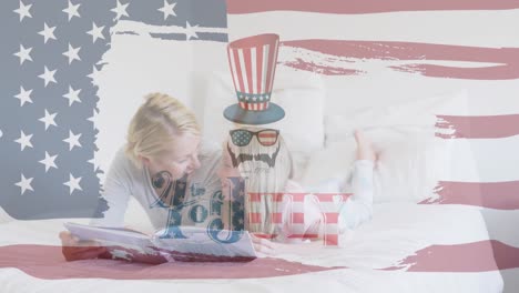 Independence-text-and-american-flag-pattern-against-caucasian-mother-and-daughter-reading-a-book