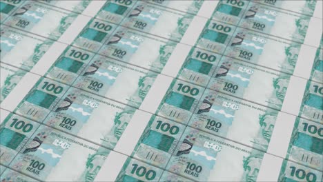 impresión de billetes de 100 reales brasileños por una imprenta de dinero
