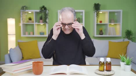 old man crying while reading a book.