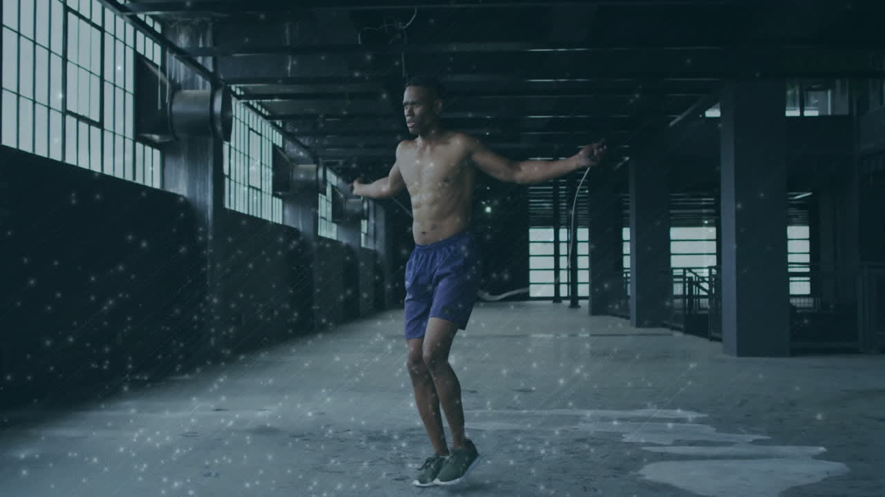 Jumping rope, shirtless man in gym with animation of snow effect