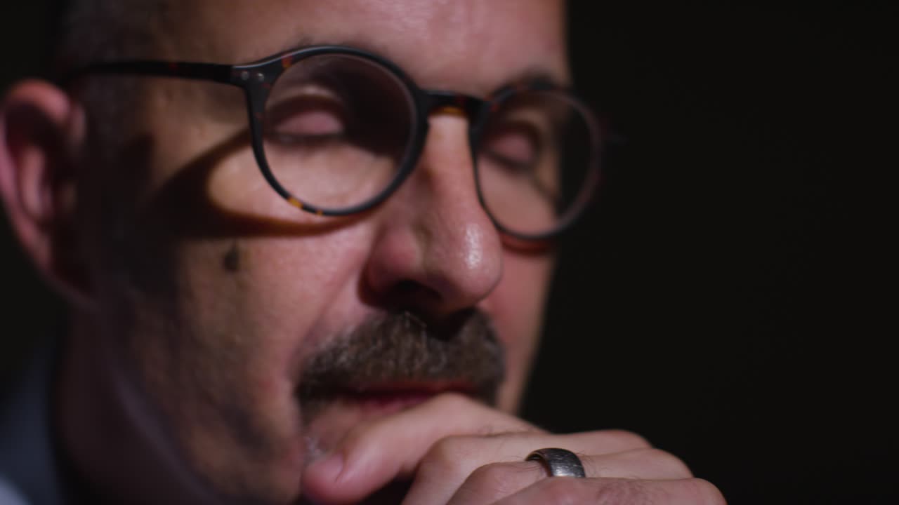 Close Up Of Depressed Mature Man Struggling With Mental Health Sitting In Darkness In Real Time With Low Key Lighting 2