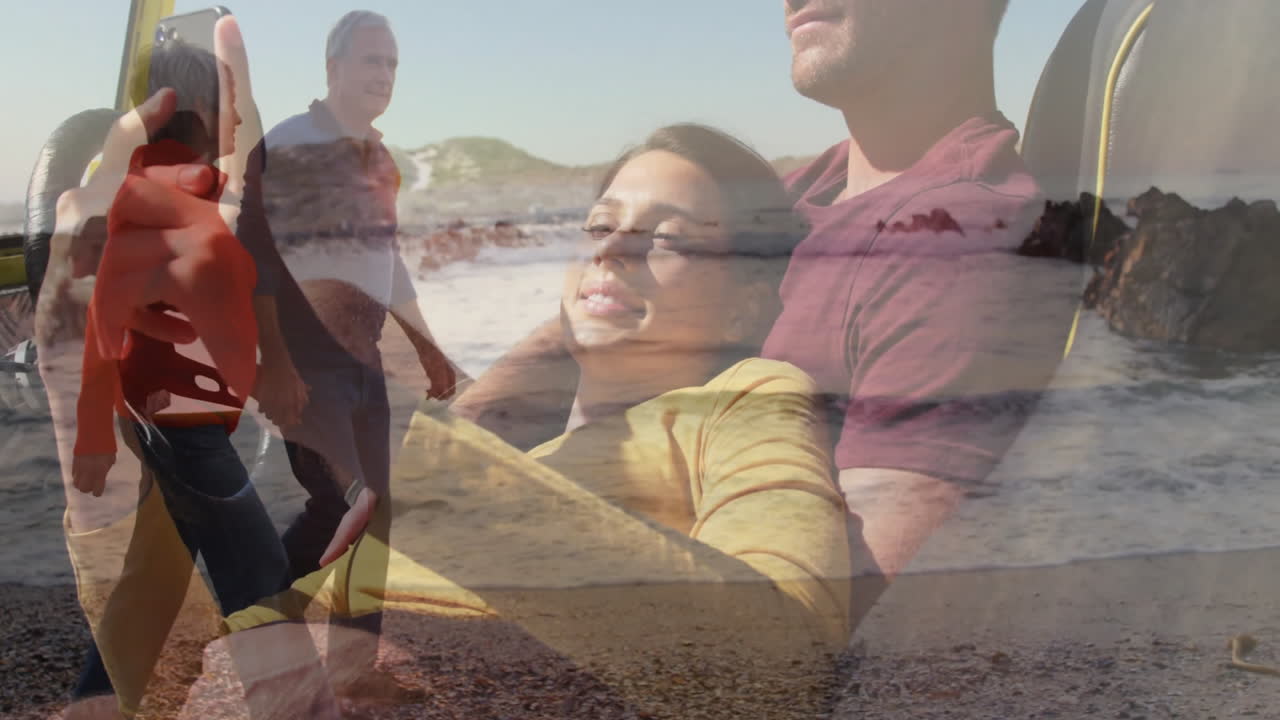 On beach, couple relaxing with animation of people walking on shore