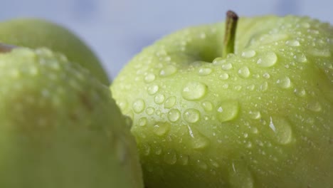 close-up of green apples with water droplets