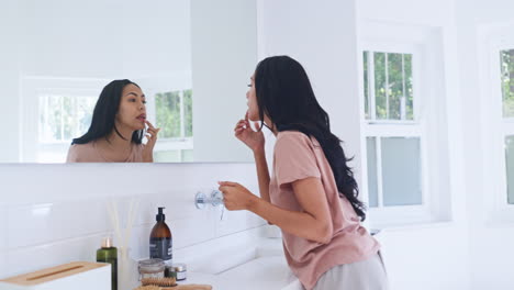 home mirror, bathroom and woman with lips gloss