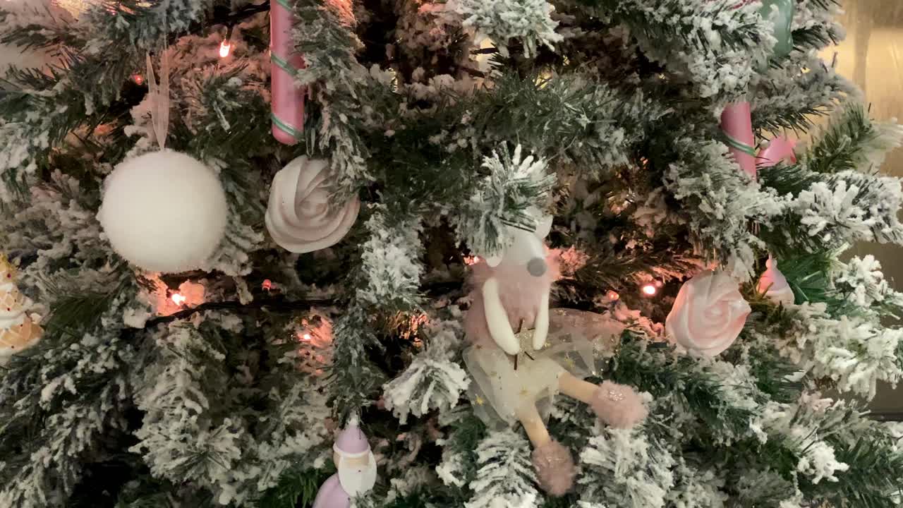 close view of Twinkling lights on a decorated Christmas tree – festive holiday concept