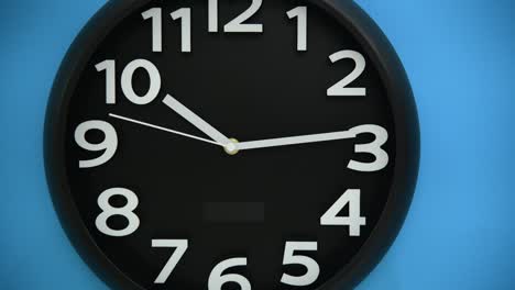 black wall clock on blue background