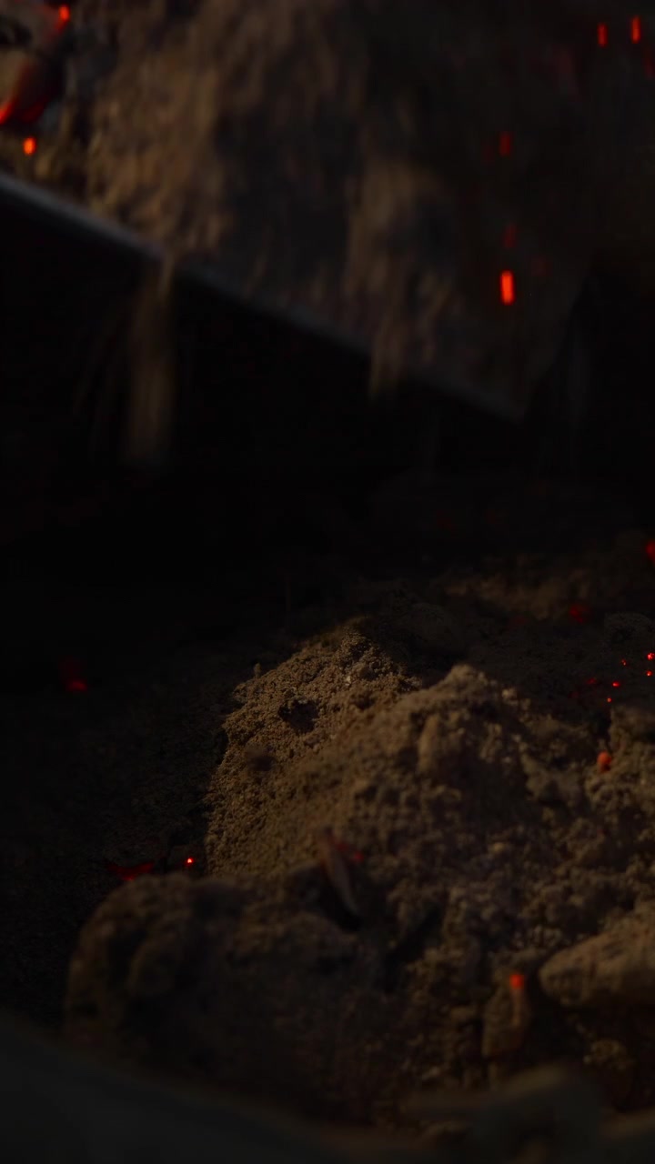 Smoldering Ash Glowing Inside Metal Brazier, Charcoal Residue And Tiny Embers, Closeup Texture Of Soot