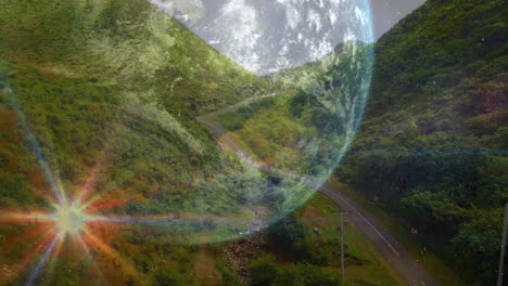 animation of spinning globe over landscape and road