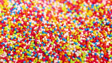 vibrant sprinkles moving in a dynamic pattern