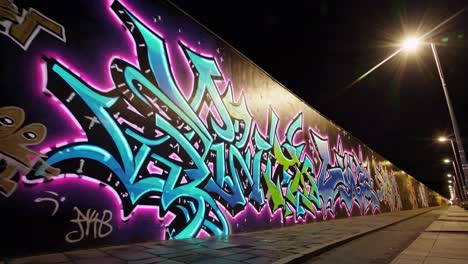 vibrant graffiti art on a city wall at night