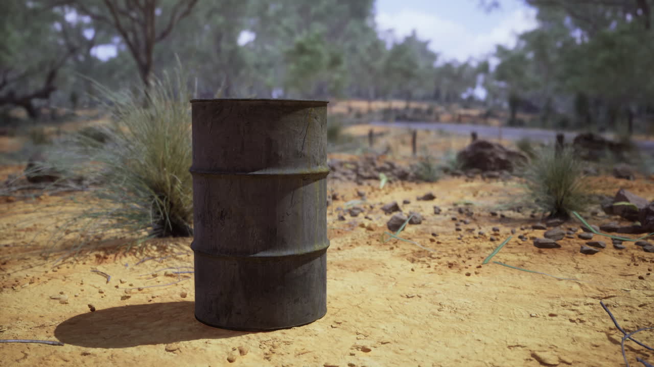 Rustic barrel stands solitary in a sunlit desert landscape during midday
