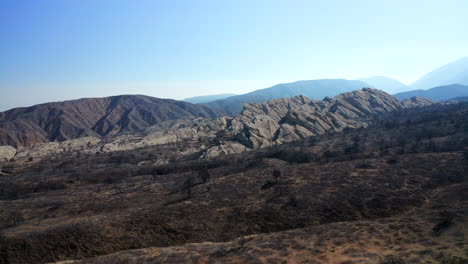 landscape burned black by the bobcat wildfire in southern california - aerial view